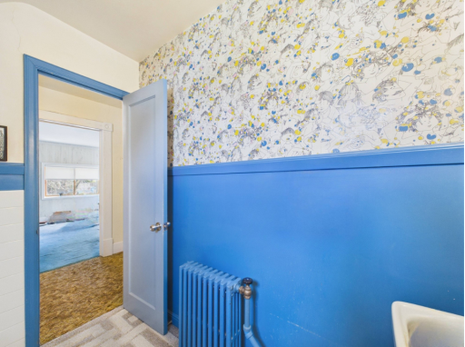 Additional bathroom space with bold vintage color and charm.