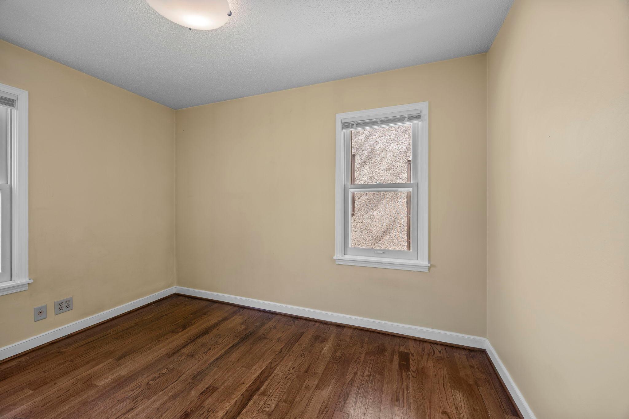 Second bedrom located on the main level bedrooms with side and bakyard views.