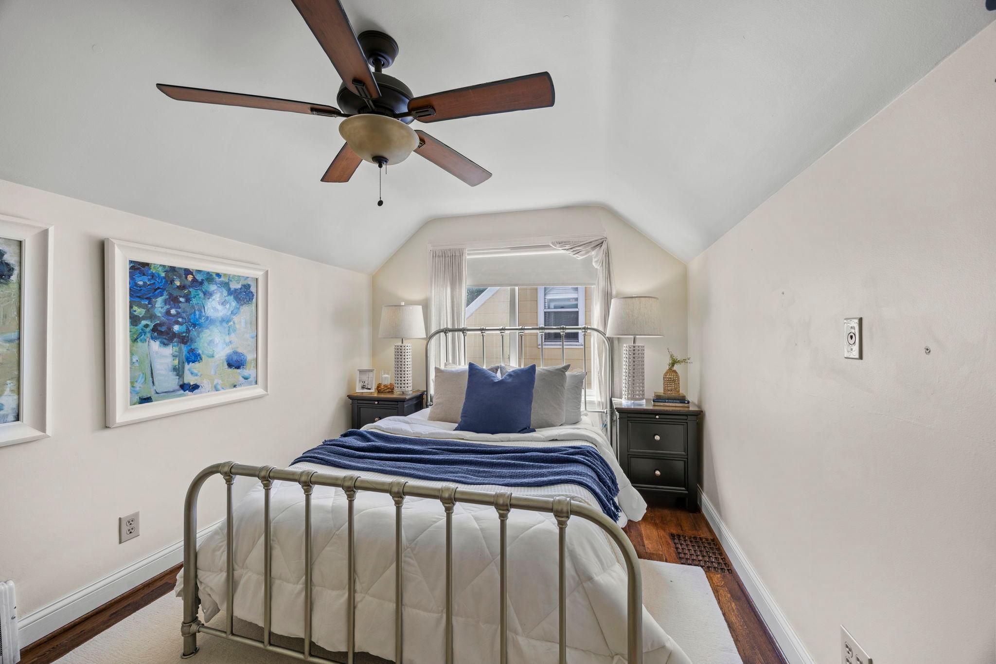 Private third bedroom with side views on the upper level.
