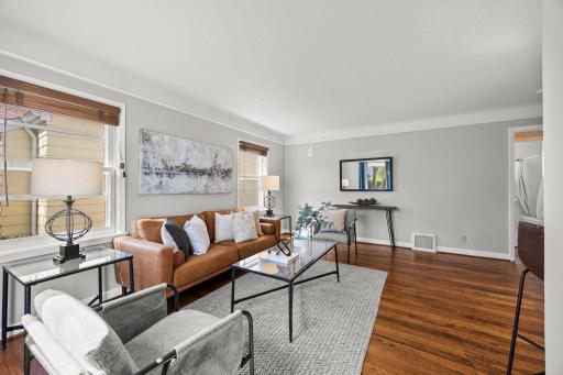 Side windows enhance the bright, airy atmosphere within the living room.