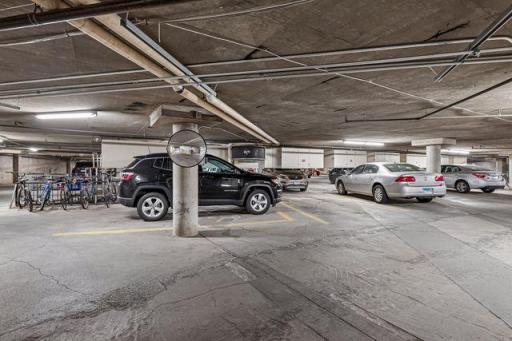 Secure parking garage with one parking stall & storage cabinet