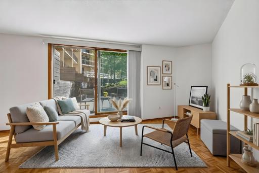 Virtually staged (example 1). Sliding glass doors walk out to patio and plaza area