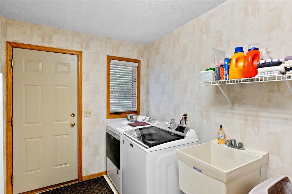 Walk in from the garage to this 14x6 Mud Room with laundry, sink and window to the front yard.