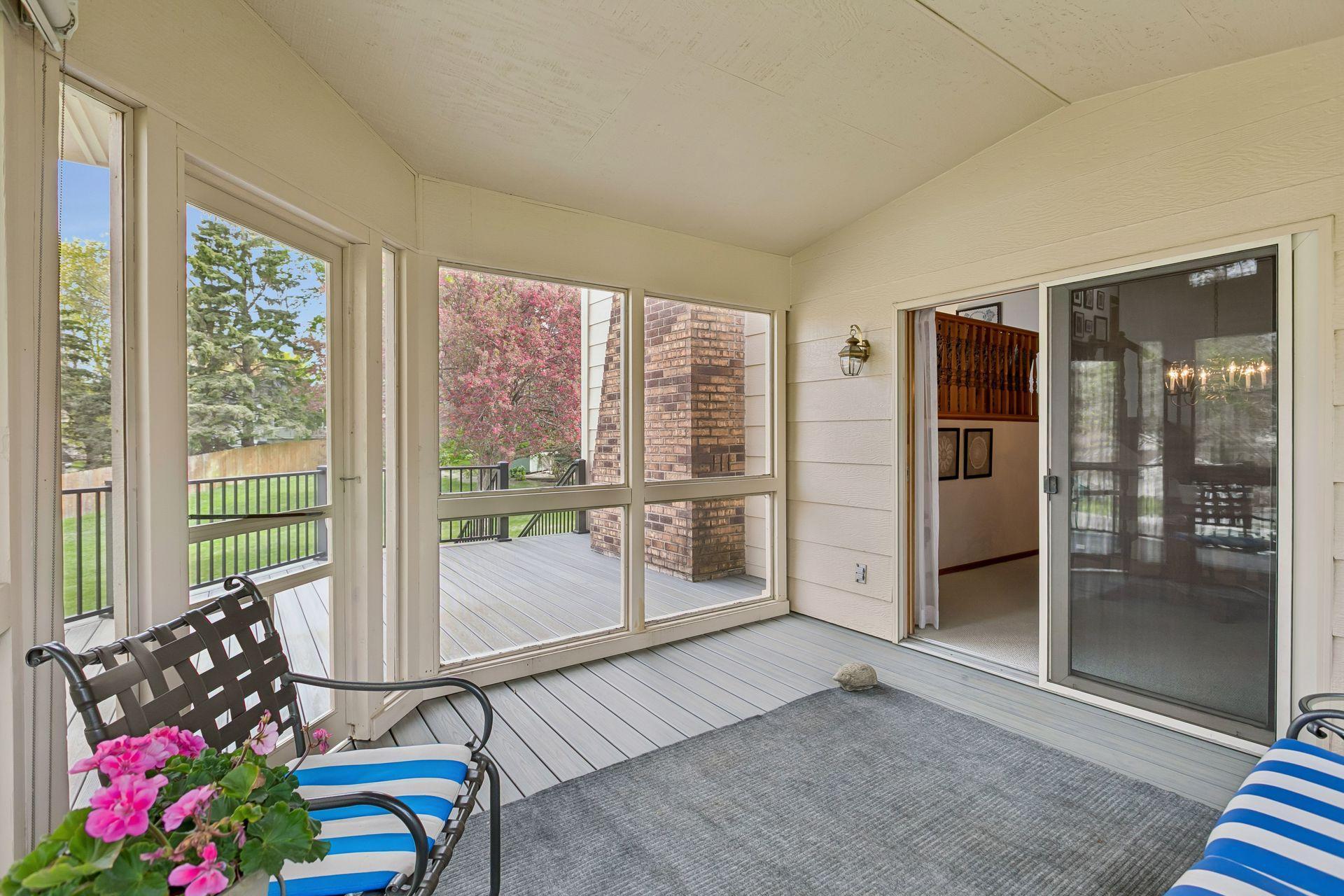 The Porch opens to the Large Trex Deck w. stairs to the Back Yard.