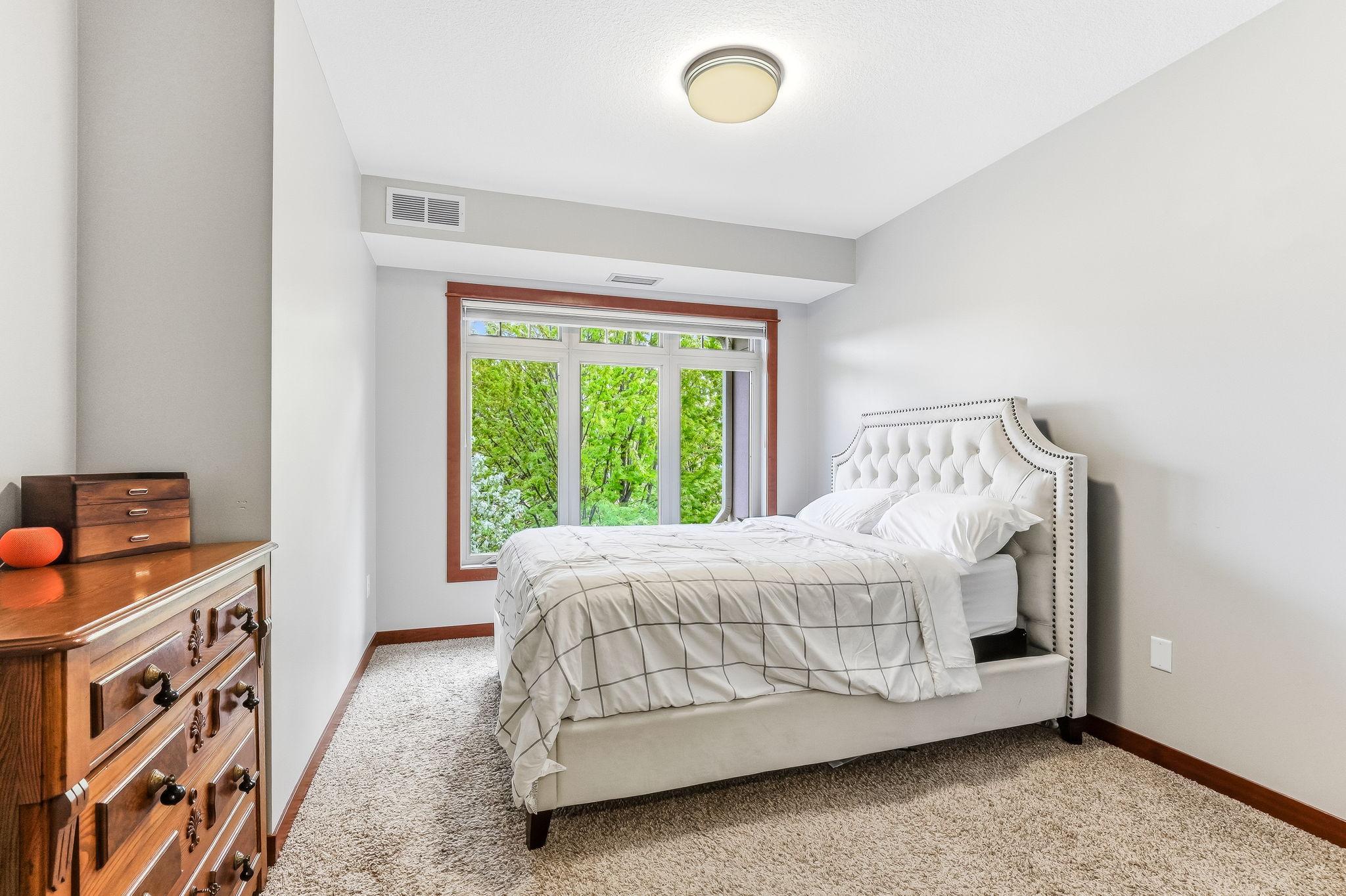 Spacious primary suite with tons of natural light and beautiful nature views.