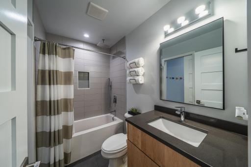 Main floor full bath with custom tile