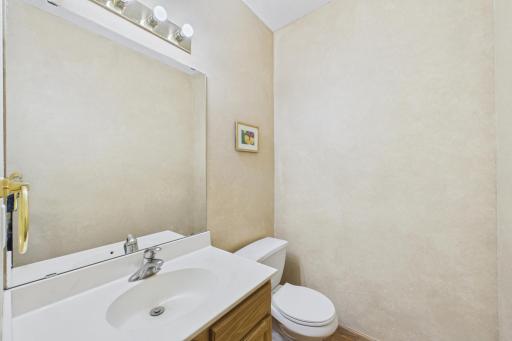 Main Level half bath is conveniently located off main living areas.