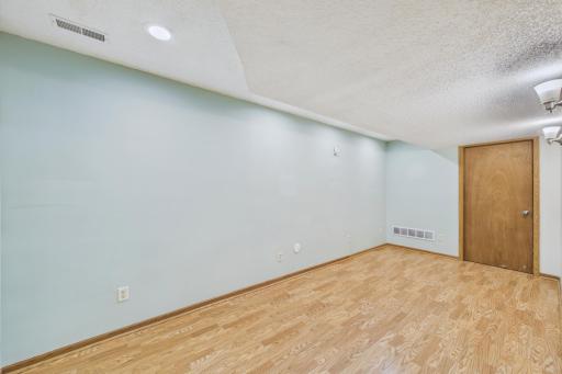 Family room is ready for your creative ideas. Would also make a great fitness room.
