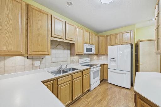 Generous counter space for cooking and ceiling-height cabinetry that enhances storage.
