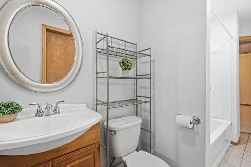 Nice pedestal sink and bright lighting