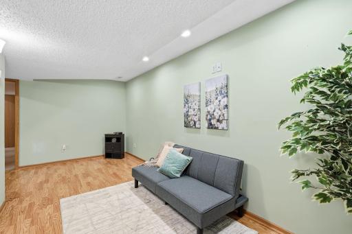 LL Family room includes recessed lighting and is a nice space to relax in.