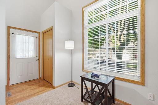 Welcoming entry way shows off huge windows.