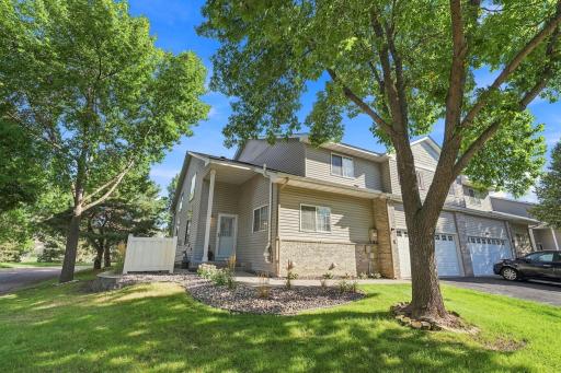Enjoy low-maintenance living with a nice yard, private patio, and desirable corner-lot setting.