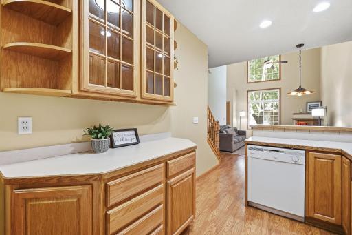 Abundant oak cabinetry, display cabinets and open shelving.