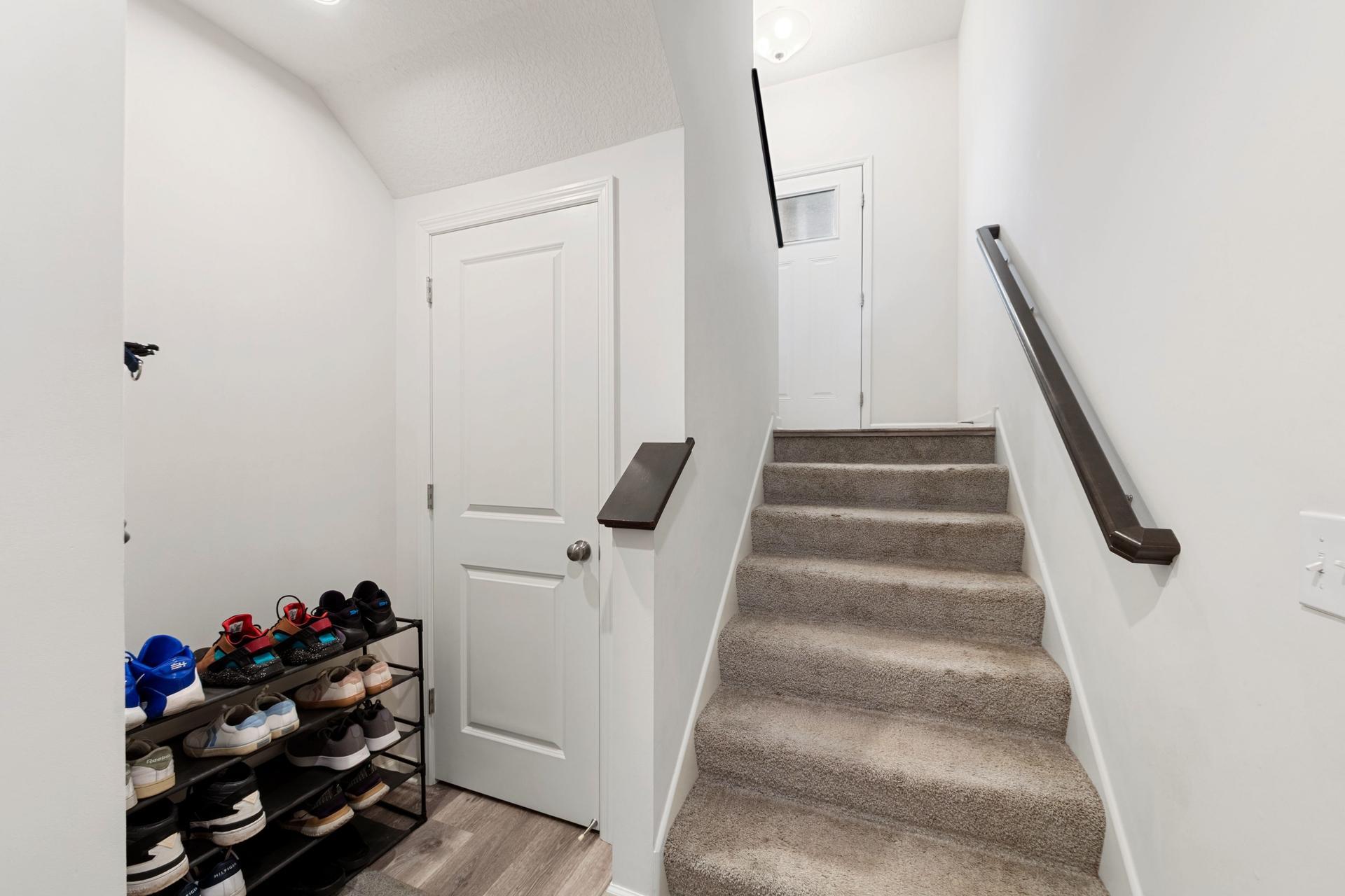 Entry from garage with closet.