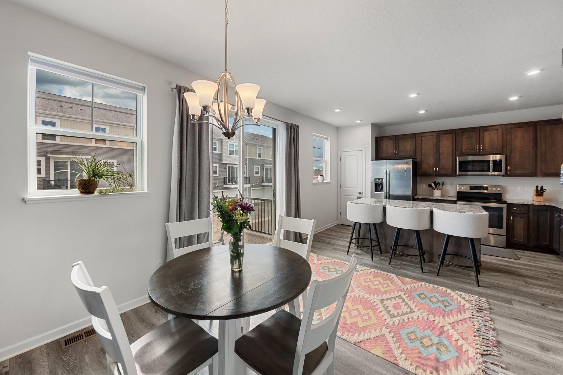 McKenney informal dining area off of kitchen. Lots of natural light with the patio doors and windows.