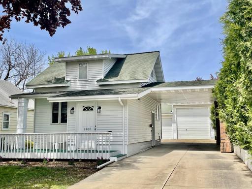 Front of home, metal siding, carport and updated windows