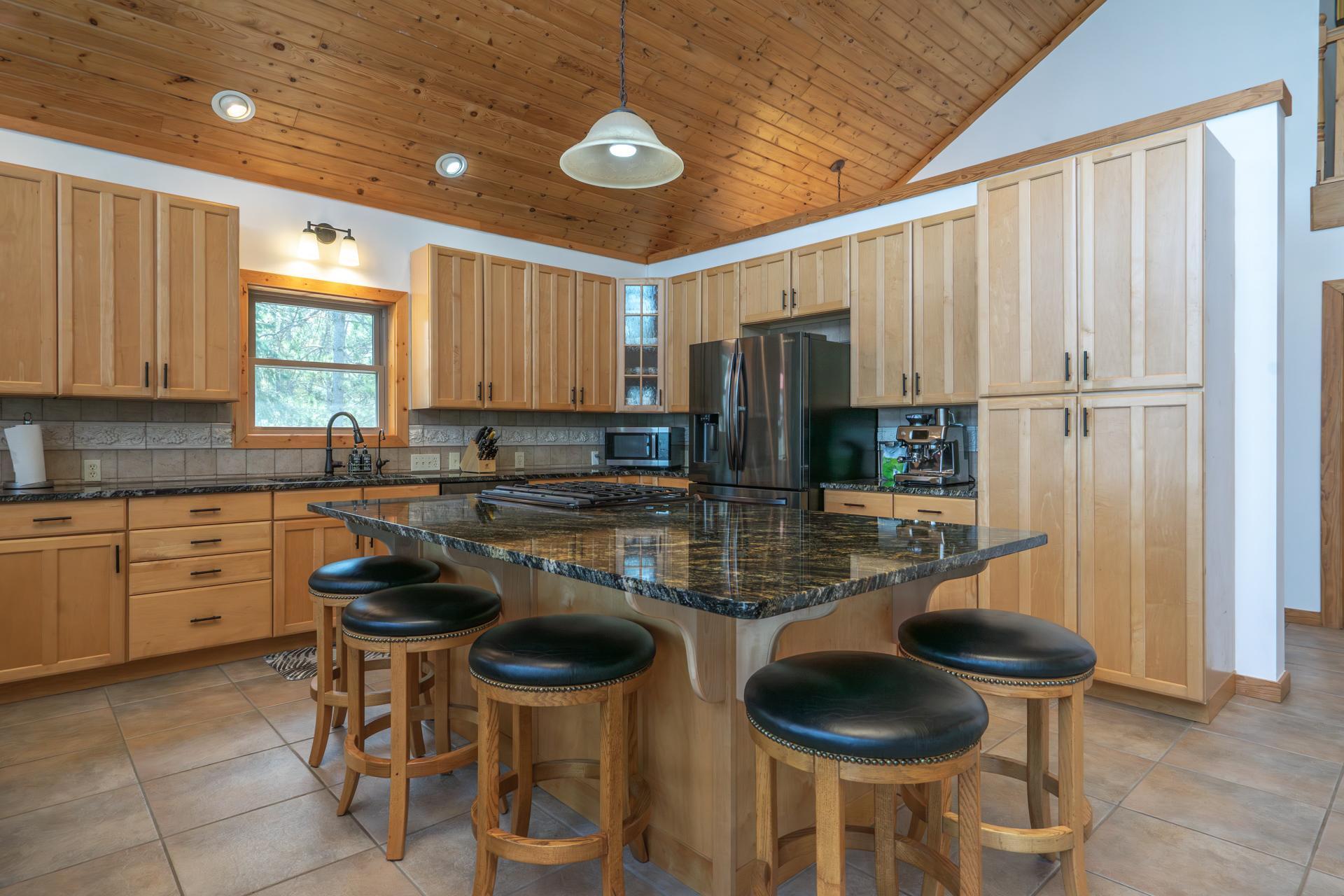 Custom kitchen with updated countertops, cabinet hardware and new sink!