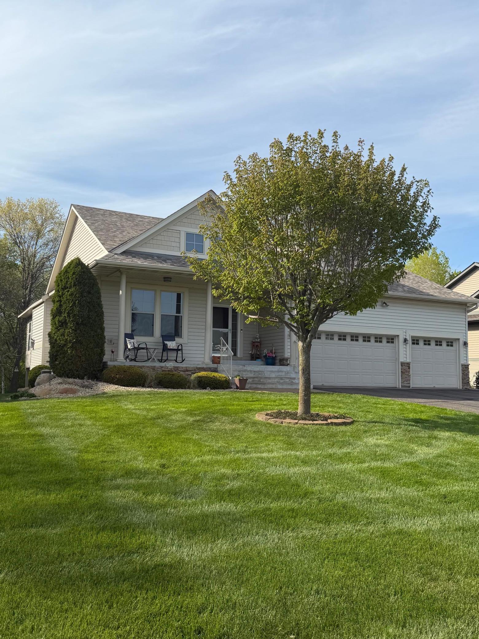 Wonderful front yard and porch with sunshine galor.
