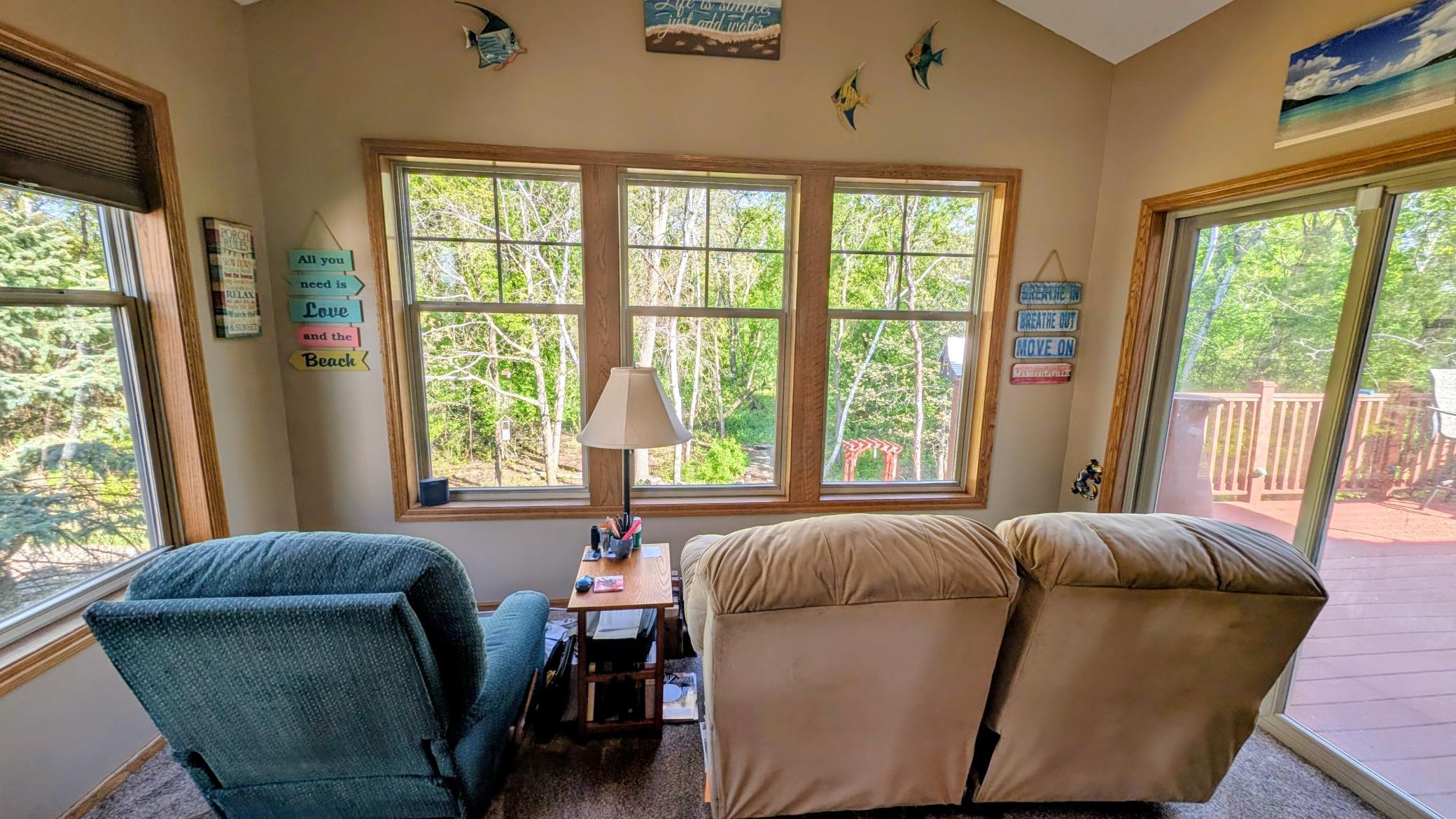 Four Season Porch looking over 40 acres of wilderness and wild life. SO MUCH tranquility here!!