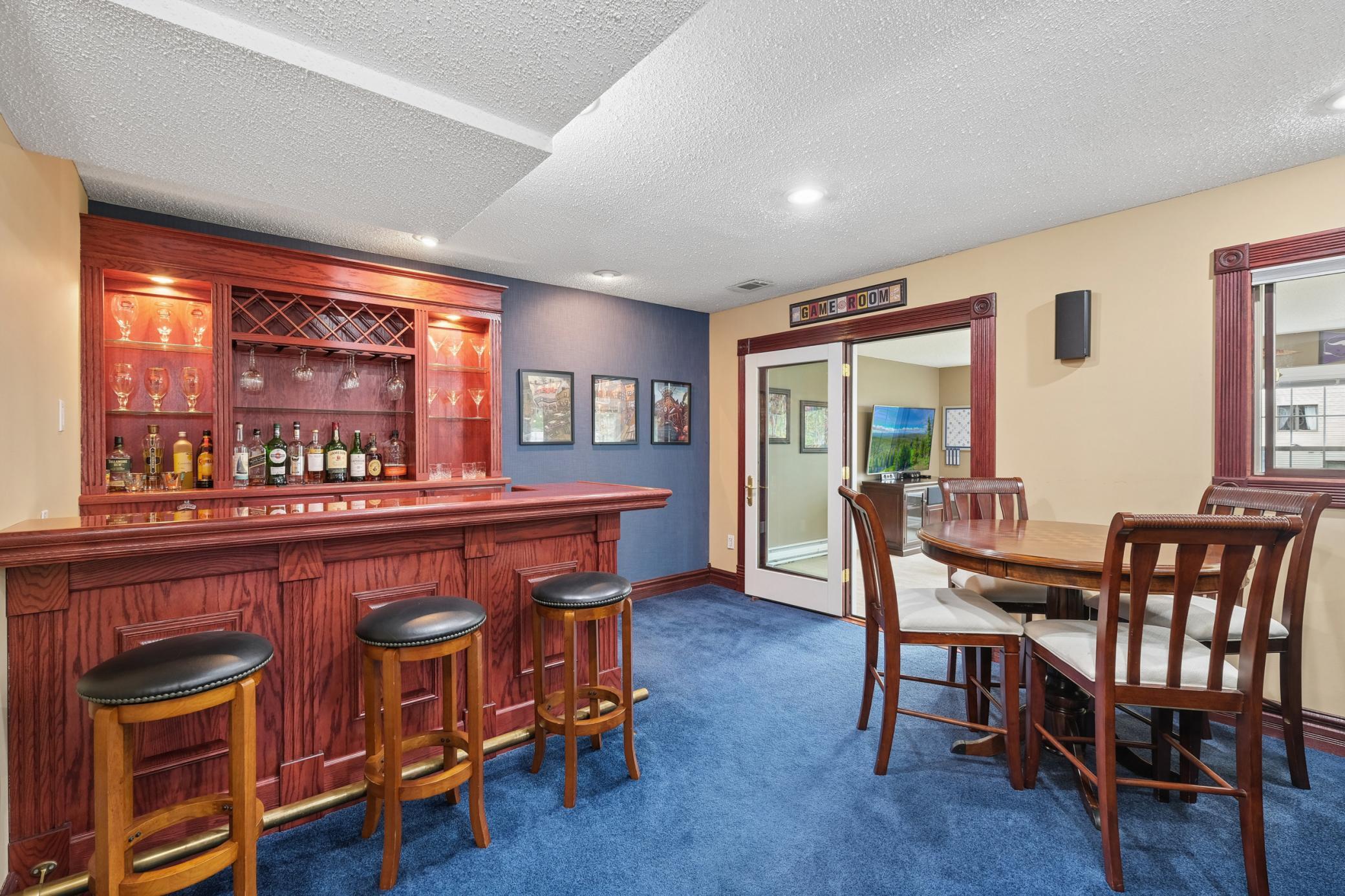 The stylish wet bar creates the ultimate entertaining hub.