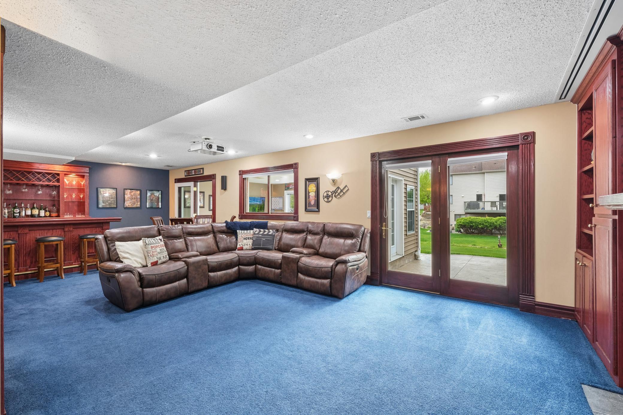 Designed for the way people truly live and entertain, this incredible lower level seamlessly extends to the outdoor living space making backyard bonfires, summer gatherings, movie nights, and gameday hosting feel effortless yearround.