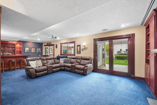 Designed for the way people truly live and entertain, this incredible lower level seamlessly extends to the outdoor living space making backyard bonfires, summer gatherings, movie nights, and gameday hosting feel effortless yearround.