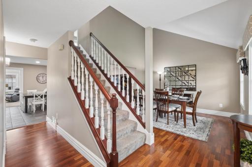The welcoming entryway features hardwood flooring and a functional open layout that connects directly to the main living areas.