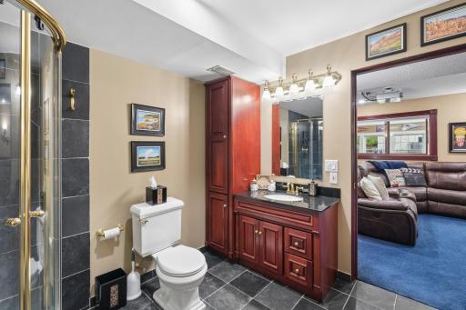 Lower level bathroom retreat. This spa-inspired bathroom features elegant tile floors that stay cool and refreshing underfoot, creating the perfect transition after an evening soak in the outdoor hot tub.