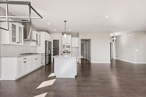 Kitchen features a walk-in pantry and connects to the mudroom