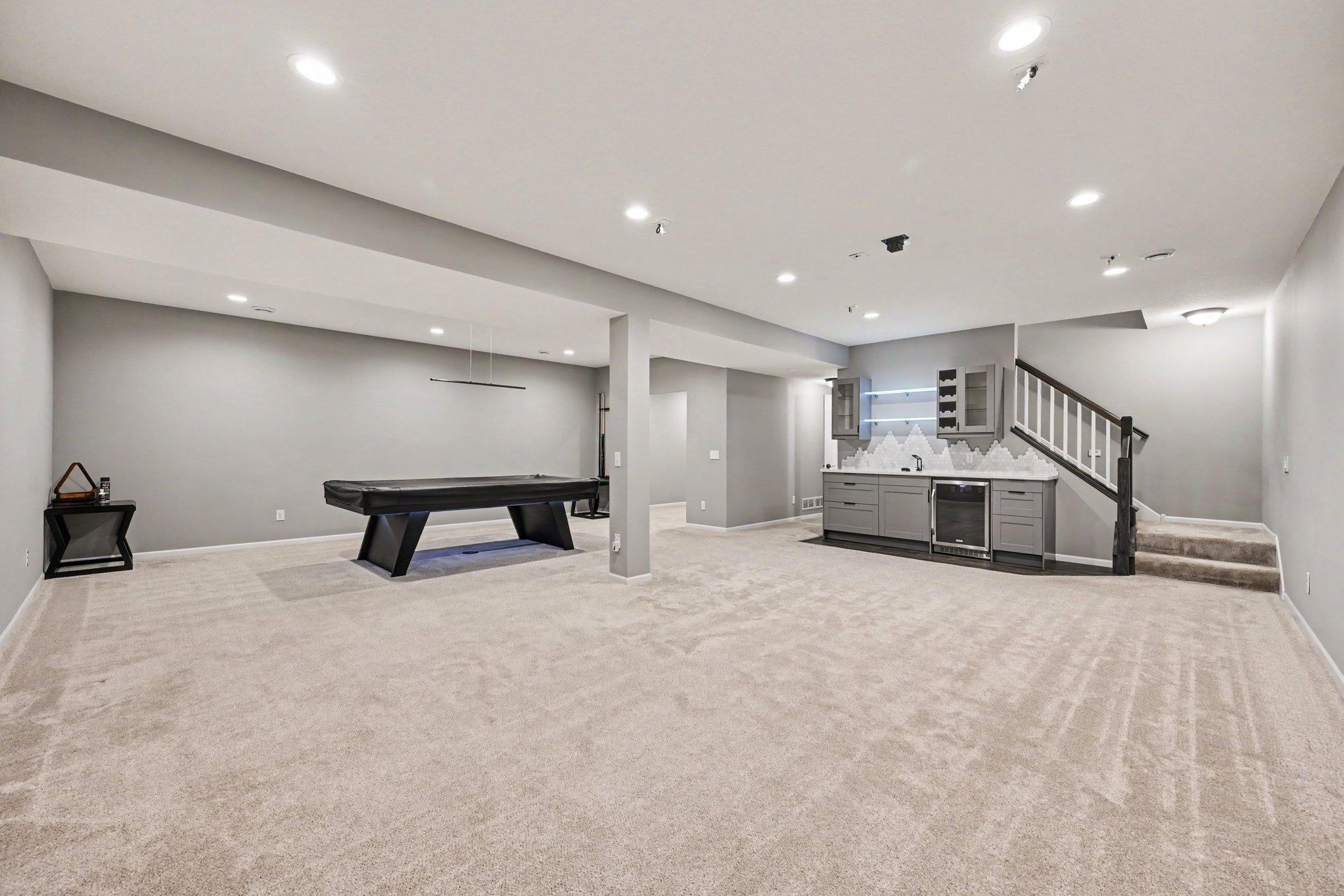 Large entertaining space with pool table, wet bar, and hookups for your very own home theater
