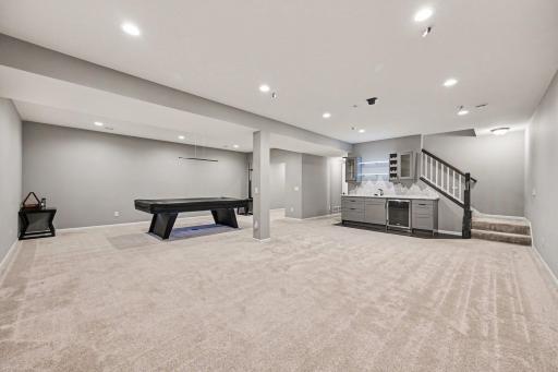 Large entertaining space with pool table, wet bar, and hookups for your very own home theater