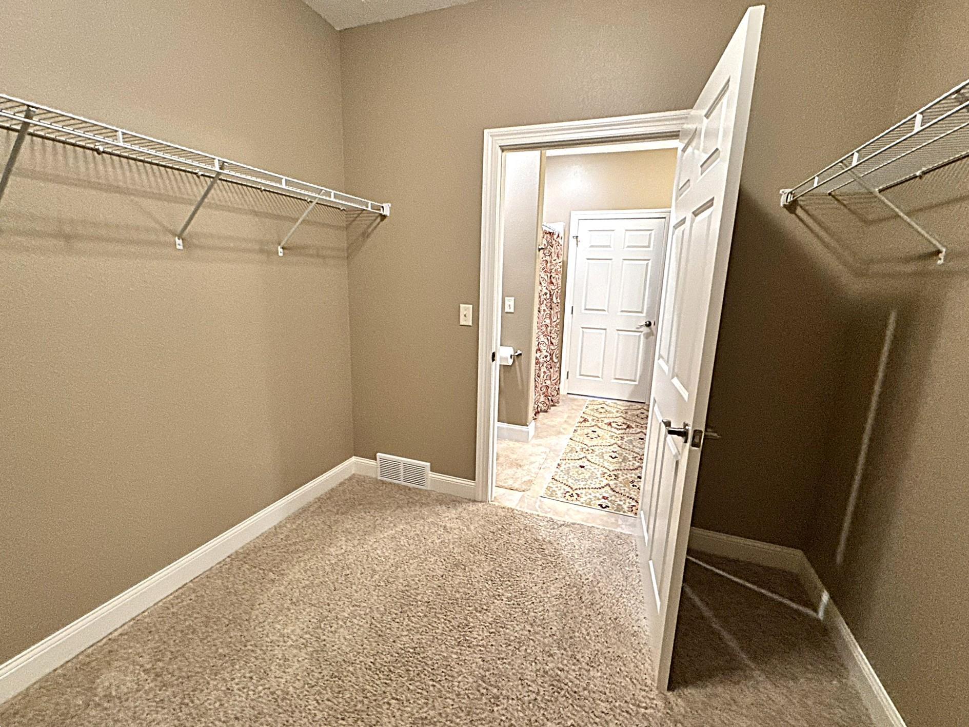 Primary Bedroom Walk in Closet.JPEG