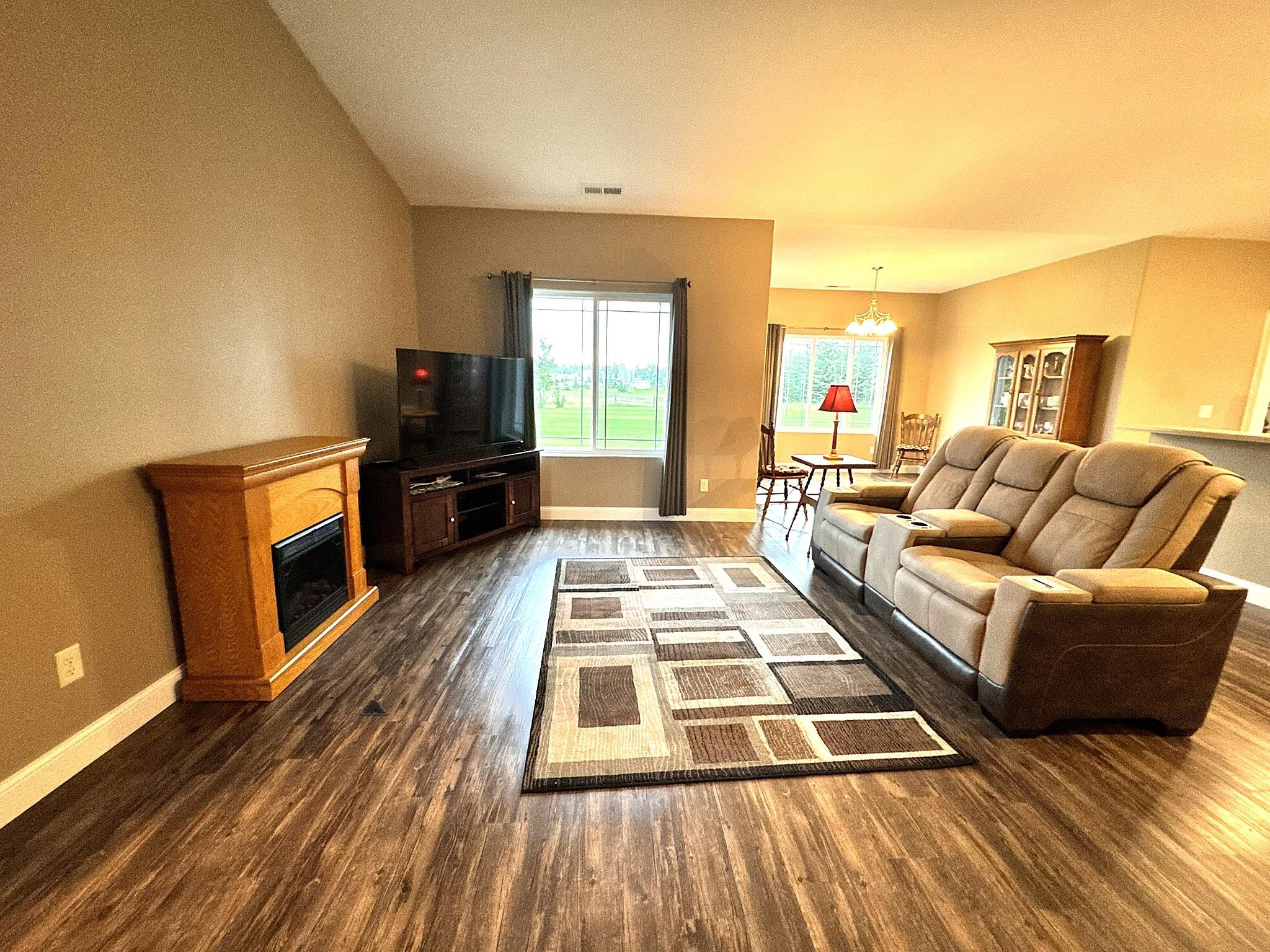 Living Room with vaulted ceiling and open floor plan.JPEG