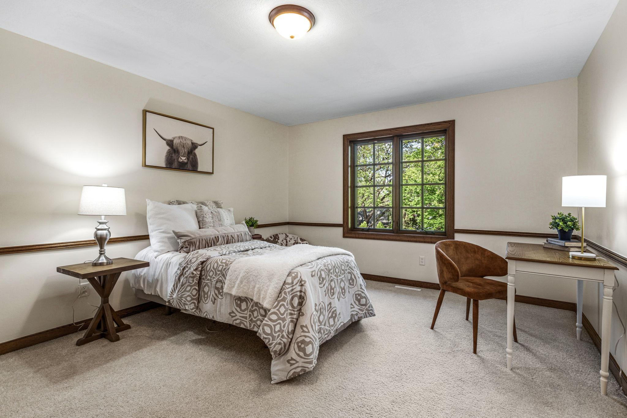 2nd bedroom on upper level with walk-in closet.