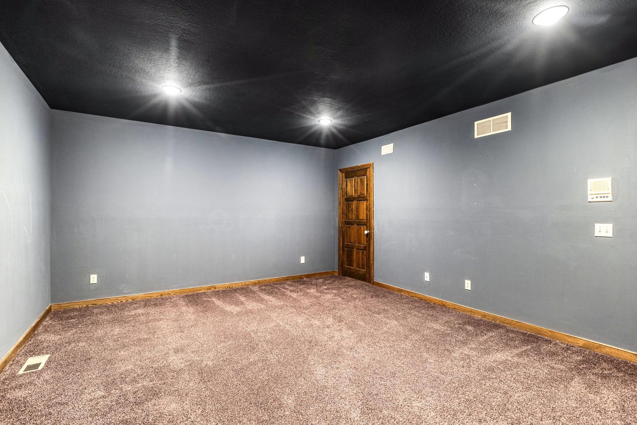 Fabulous flex space perfect for a home theater or exercise room!
