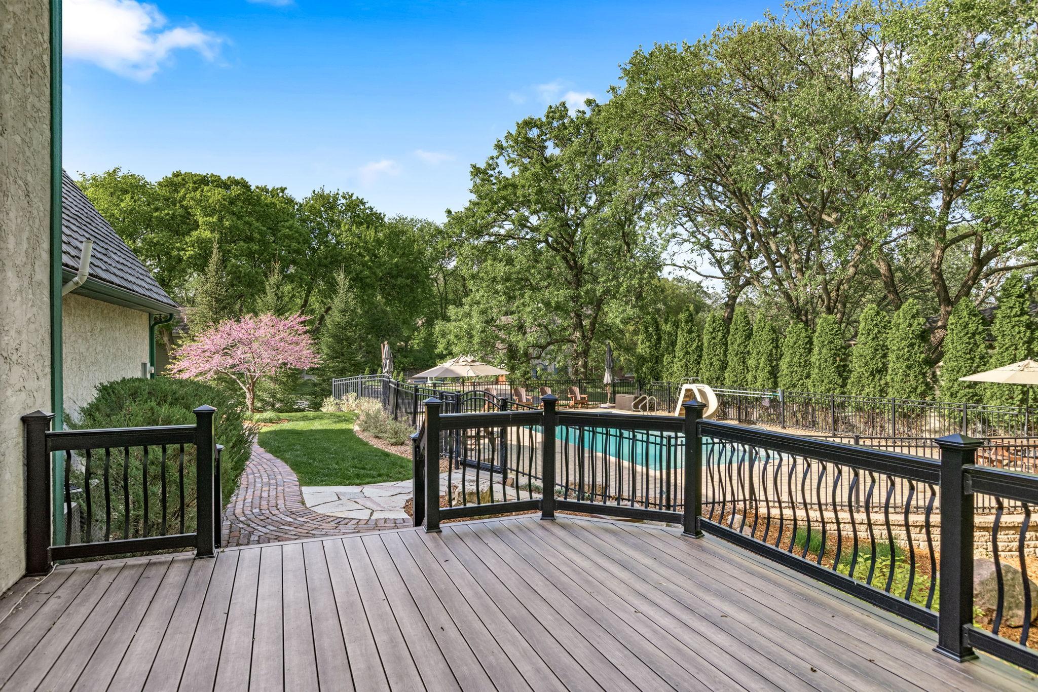 Maintenance free deck leading to the backyard oasis!