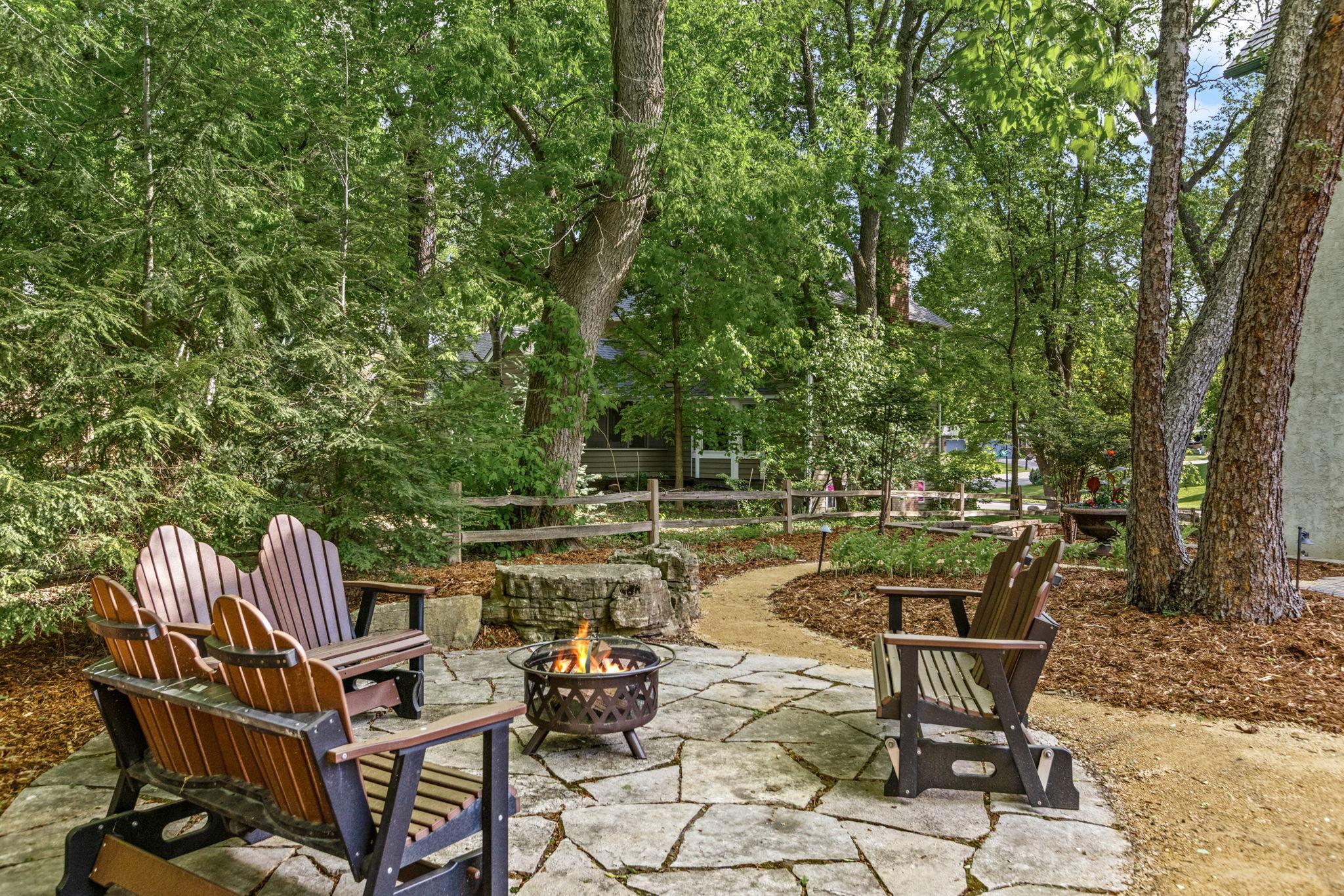 Gather around the firepit, bring the s’mores and enjoy this peaceful backyard retreat!