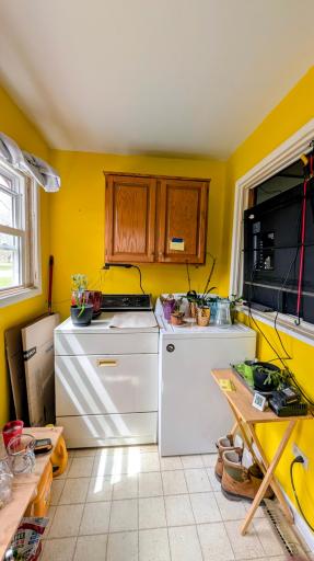 Sun drenched Main floor porch/laundry