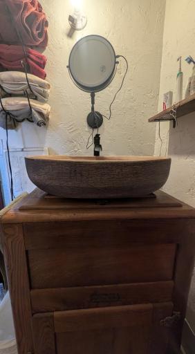 bathroom sink vanity is made from an old ice box.jpg