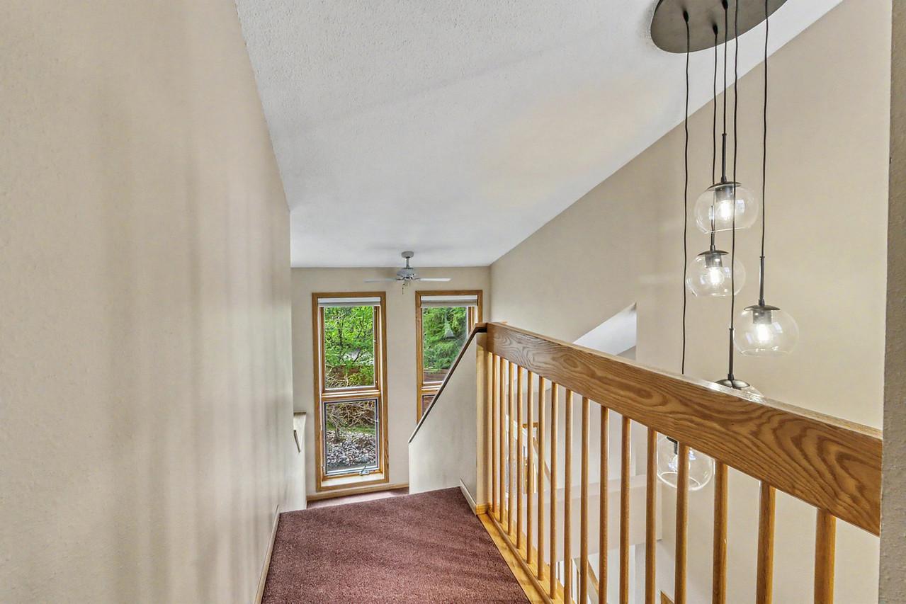 Upstairs landing w/ elegant lighting