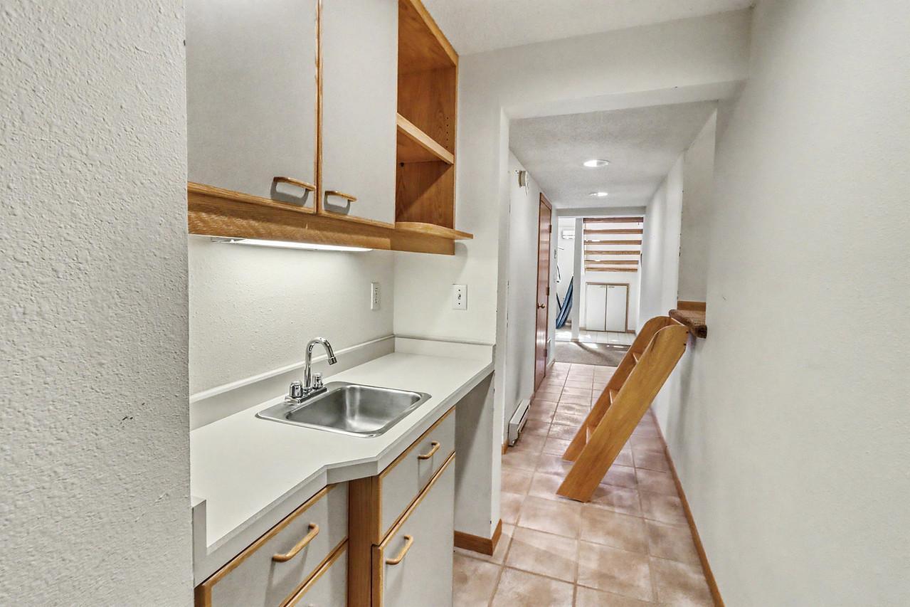 Basement Hallway w/ crawlspace room