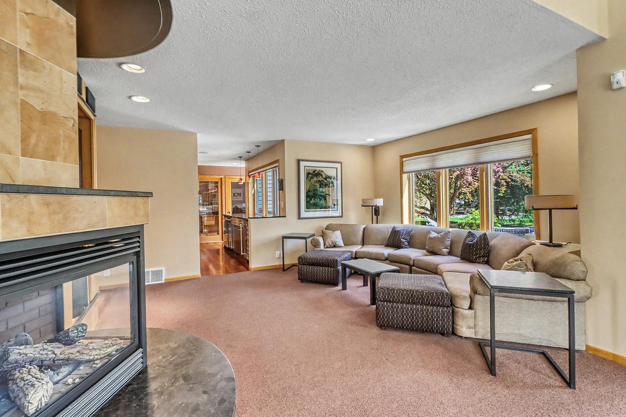 Living Room w/ large windows to backyard