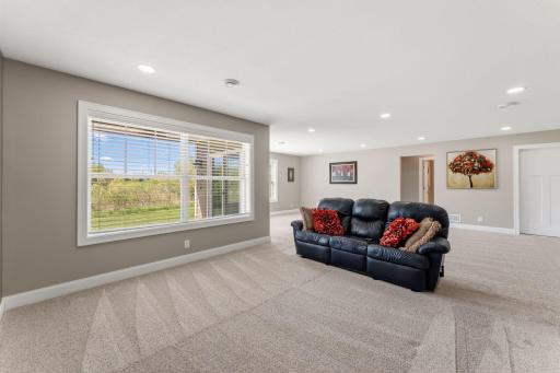 Lower level has large windows and a patio door for great views