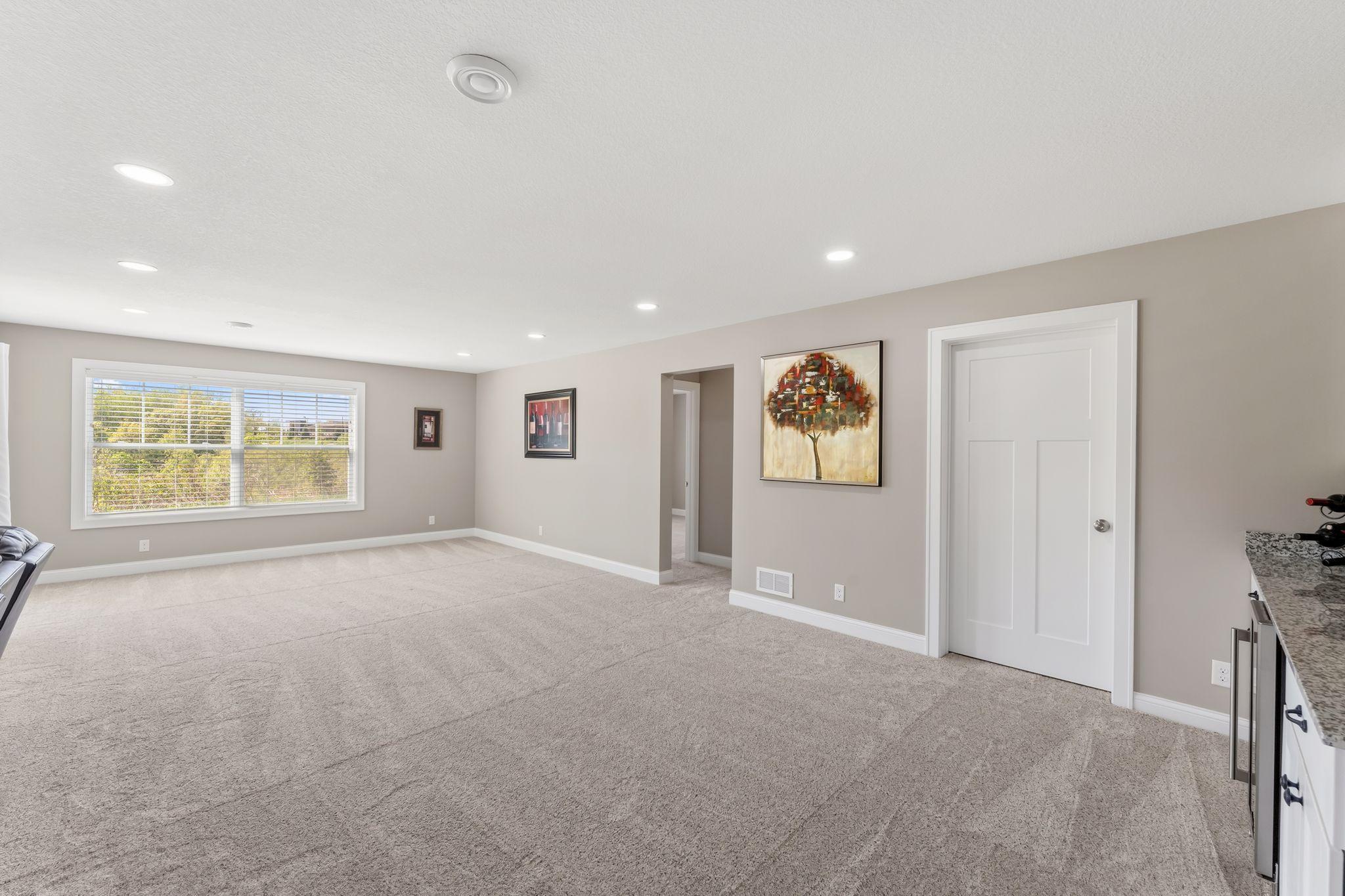 Lower level includes a den or computer room