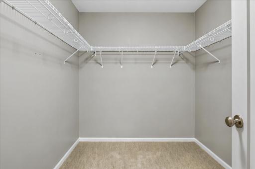 The spacious walk-in closet in the primary bedroom provides excellent storage and organization, adding comfort and functionality to your private retreat.
