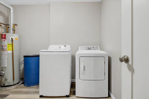 Even the practical spaces are ready for you, with a dedicated laundry area featuring newer washer and dryer for added convenience.