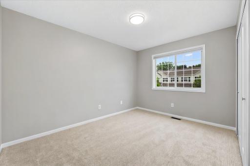 This spacious bedroom offers comfort, flexibility, and natural lightâideal for guests, family, or a dedicated workspace.