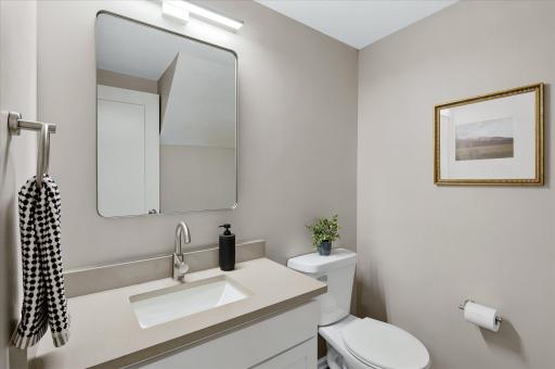 Updated fixtures and fresh finishes elevate even the smallest spaces, giving this main-level bath a clean and polished look.