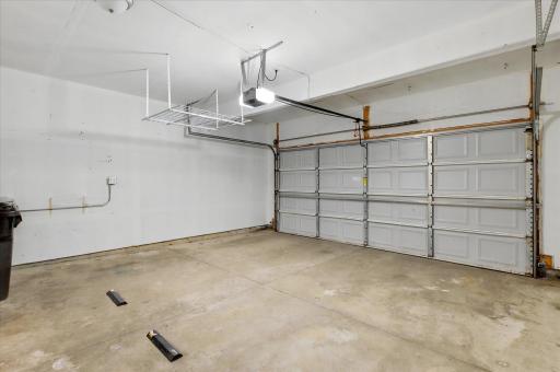 The private two-car garage offers plenty of room for parking, storage, and everyday convenienceâmaking Minnesota living that much easier in every season.
